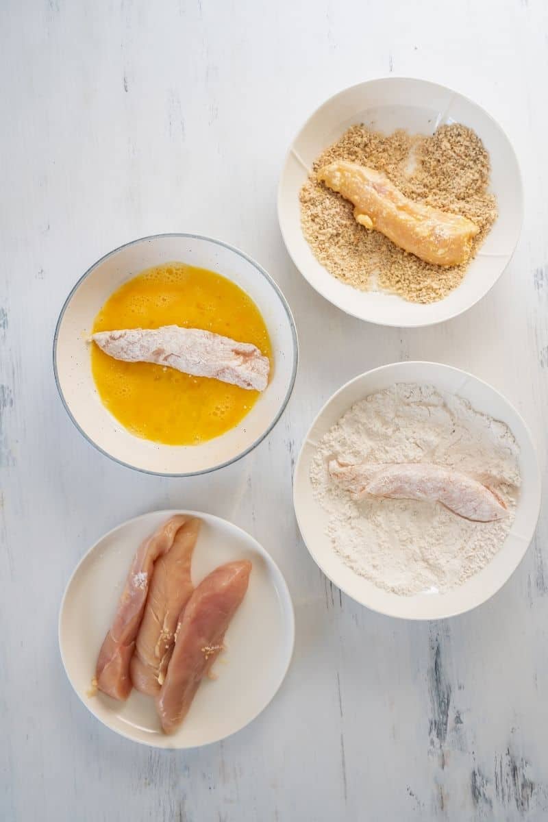 Titled Picture and shown: Light and Crispy Air Fryer Chicken Tenders (on a white plate)