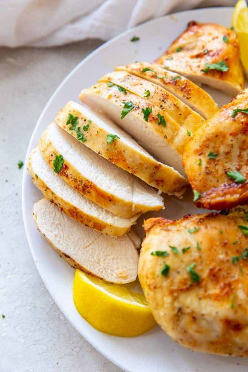 Air Fryer Chicken Breasys on a white plate
