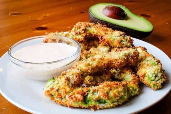 Avocado Fries with Dipping Sauce and Avocado cut in half