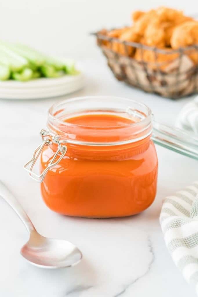 Buffalo sauce stored in a mason jar