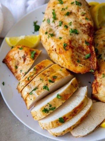 2 Air Fryer Chicken Breasts on a white plate