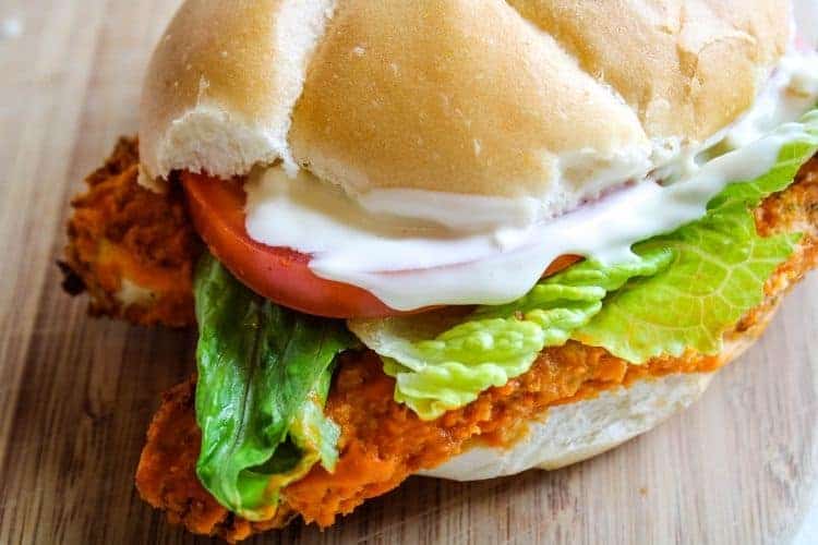 Buffalo Chicken Sandwich on a wooden cutting board