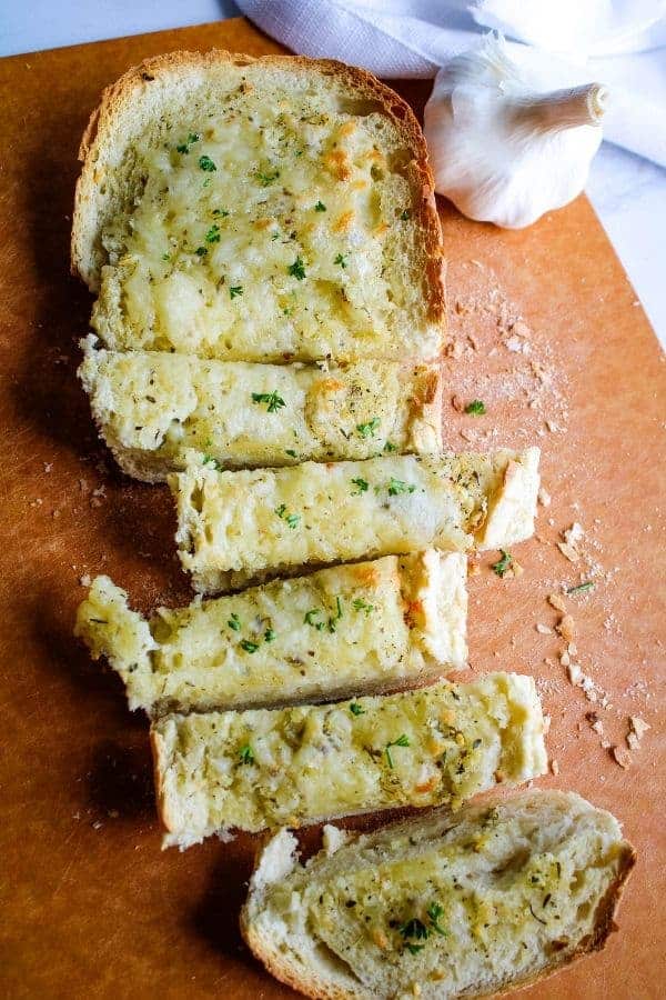 Long Picture of Garlic Cheese Bread Sliced on a cuttig board