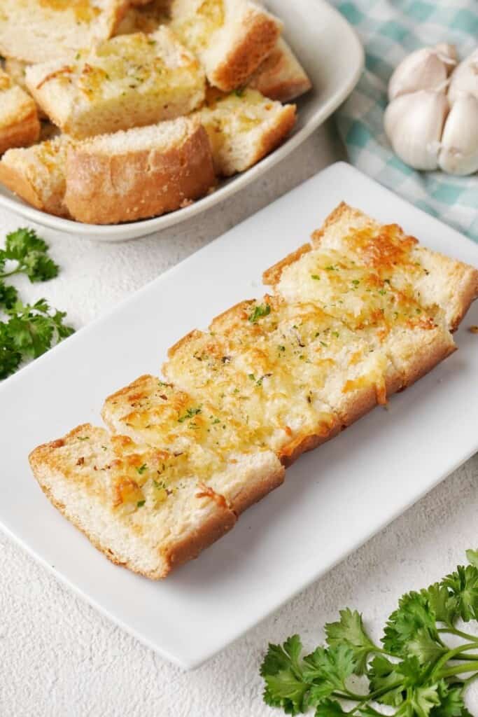Sliced garlic cheese bread on a plate 