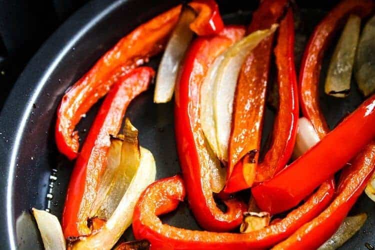 Air Fryer Roasted Red Peppers and Onions in an air fryer pan