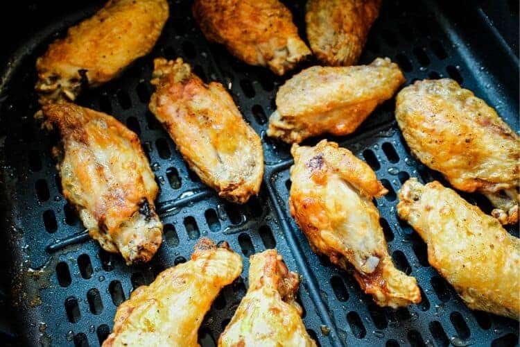 Cooked chicken wings inside air fryer