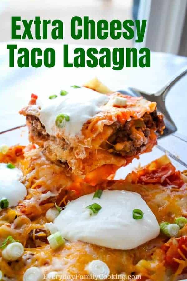 Title and Shown: Extra Cheesy Taco Lasagna (with slice being picked up out of casserole dish)