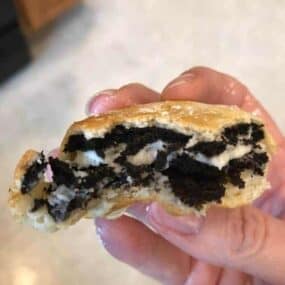Air Fried Oreo held in hand with bite out of it
