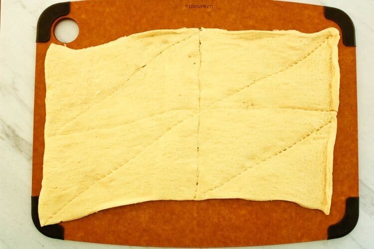 Crescent Roll Sheet laid out flat on a cutting board