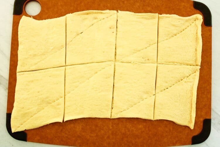 Air Fryer Crescents Sheet Cut into 8 even squares on cutting board