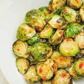 Air Fryer Sweet and Spicy Brussel Sprouts on a white plate
