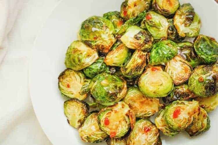 Air Fryer Sweet and Spicy Brussel Sprouts on a white plate