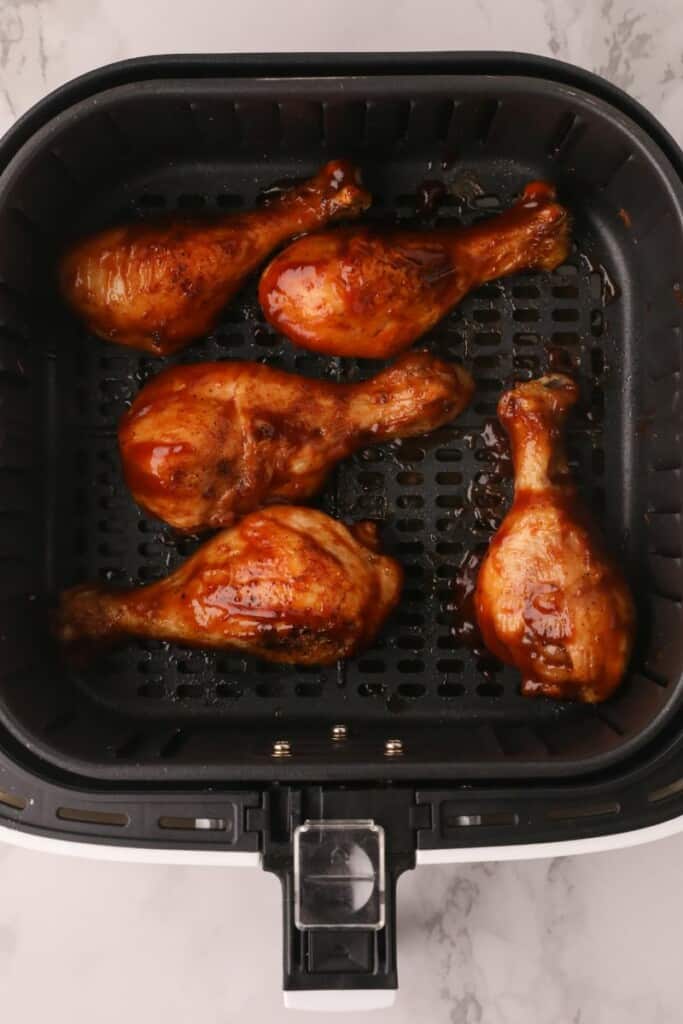BBQ chicken drumsticks in air fryer basket
