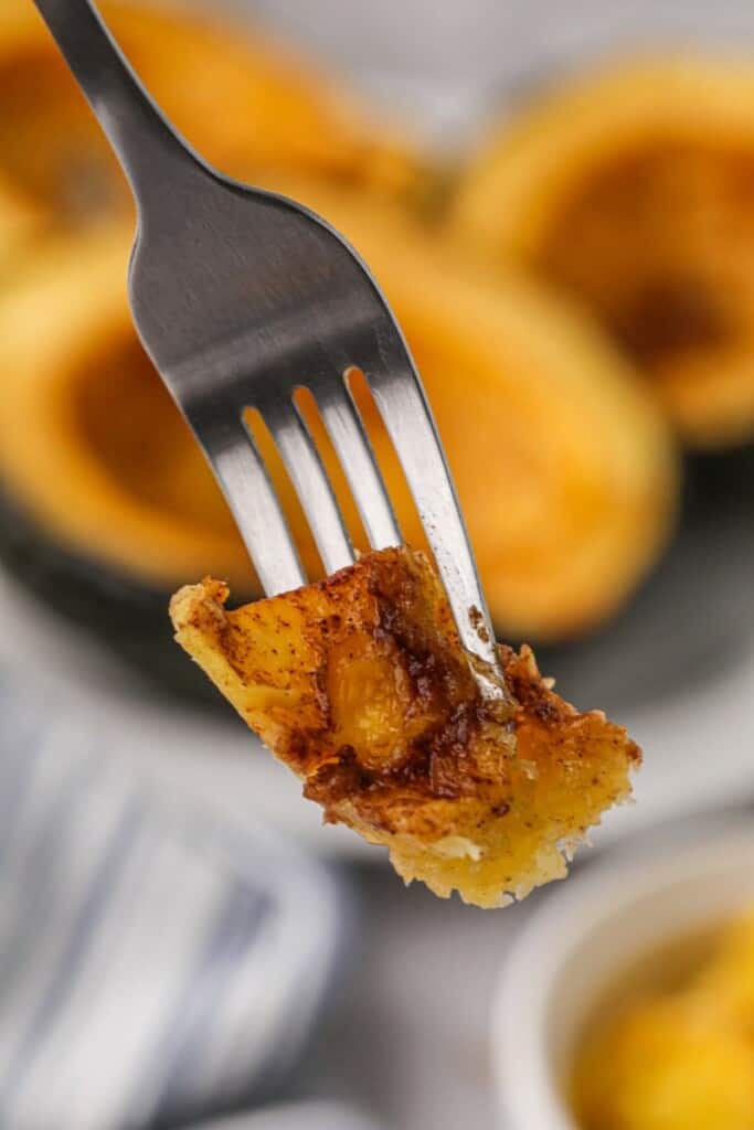 Bite of cooked acorn squash on a fork