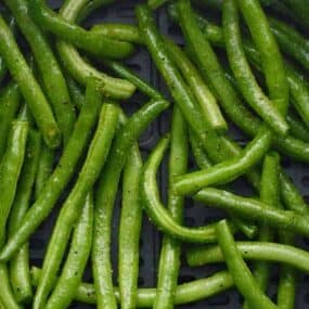 Closeup of Asian Air Fryer Green Beans on a white plate