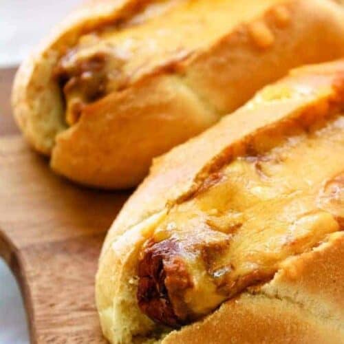 Chili Cheese Air Fryer Dogs on a cutting board