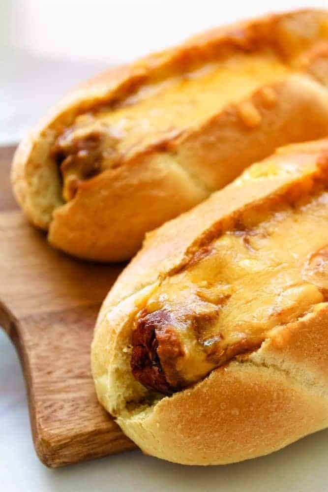 Chili Cheese Air Fryer Dogs on a cutting board