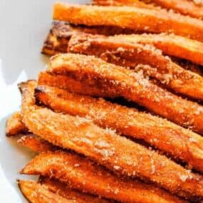 air fryer sweet potato dessert fries on a white plate