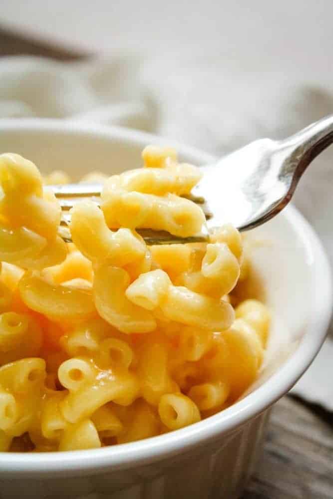 Instant Pot Mac and Cheese with a fork picking up noodles