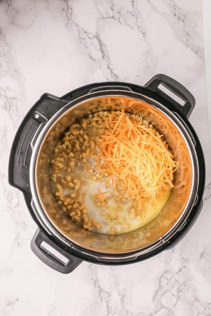 Shredded cheese and milk added to Instant Pot