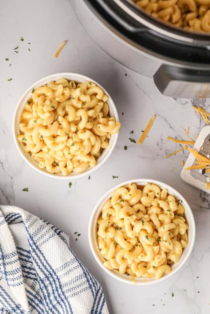 Overhead view of two bowls full of macaroni and cheese