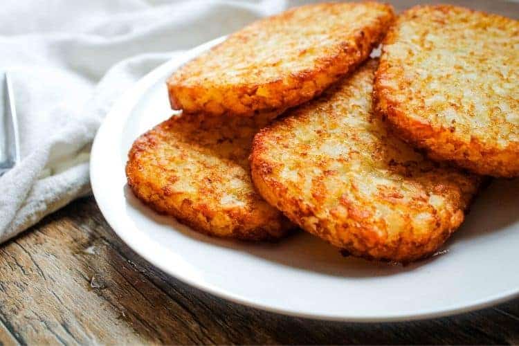 Air Fryer Frozen Hash Brown Patties on a white plate
