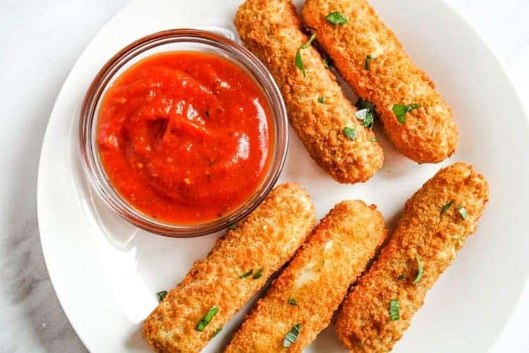 Over Top View of Mozzarella Sticks with Marinara Sauce