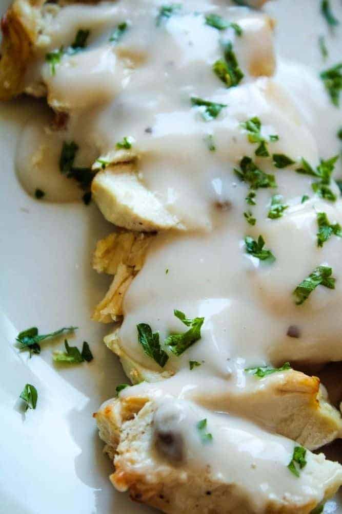 Closeup of air fryer turkey in easy mushroom sauce sliced