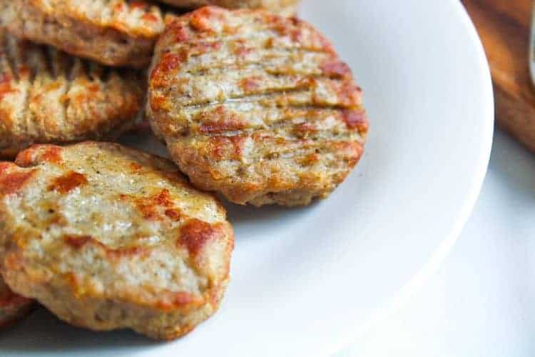 Cooked Air Fryer Sausage Patties on a white plate