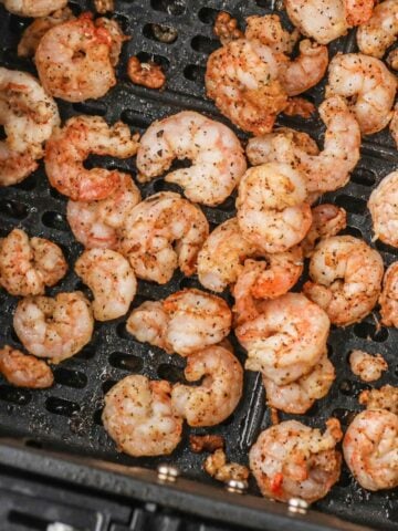 Closeup of shrimp in air fryer basket