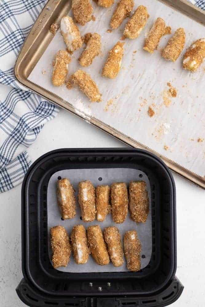 Apple wedges in air fryer and half on baking sheet