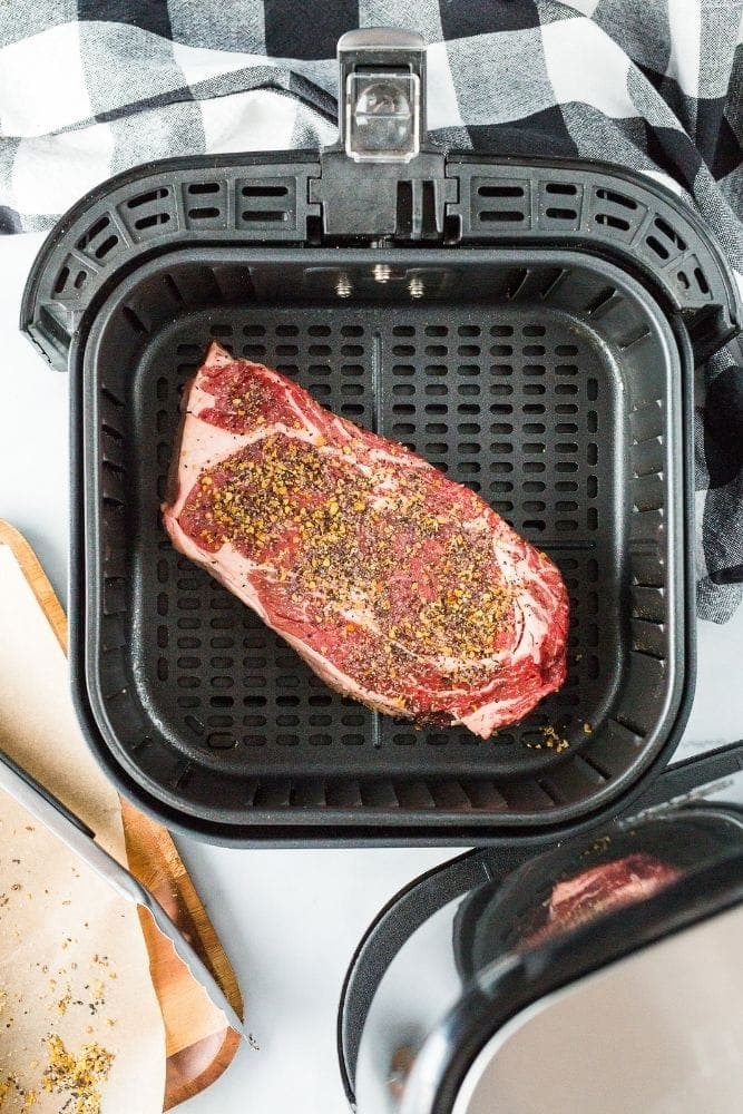 Raw ribeye steak in air fryer