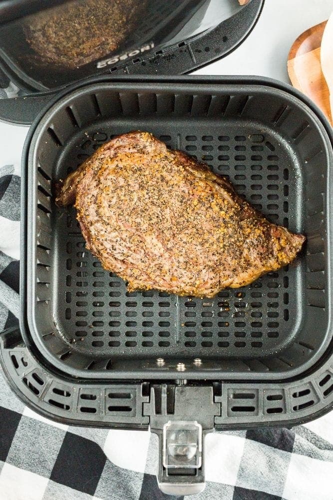 Cooked steak inside air fryer