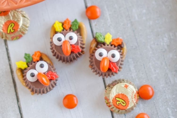 3 candy turkey crafts together with wrapped mini Reese's cups