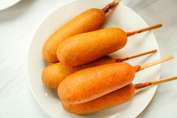 Air Fryer Corn Dogs on a white plate