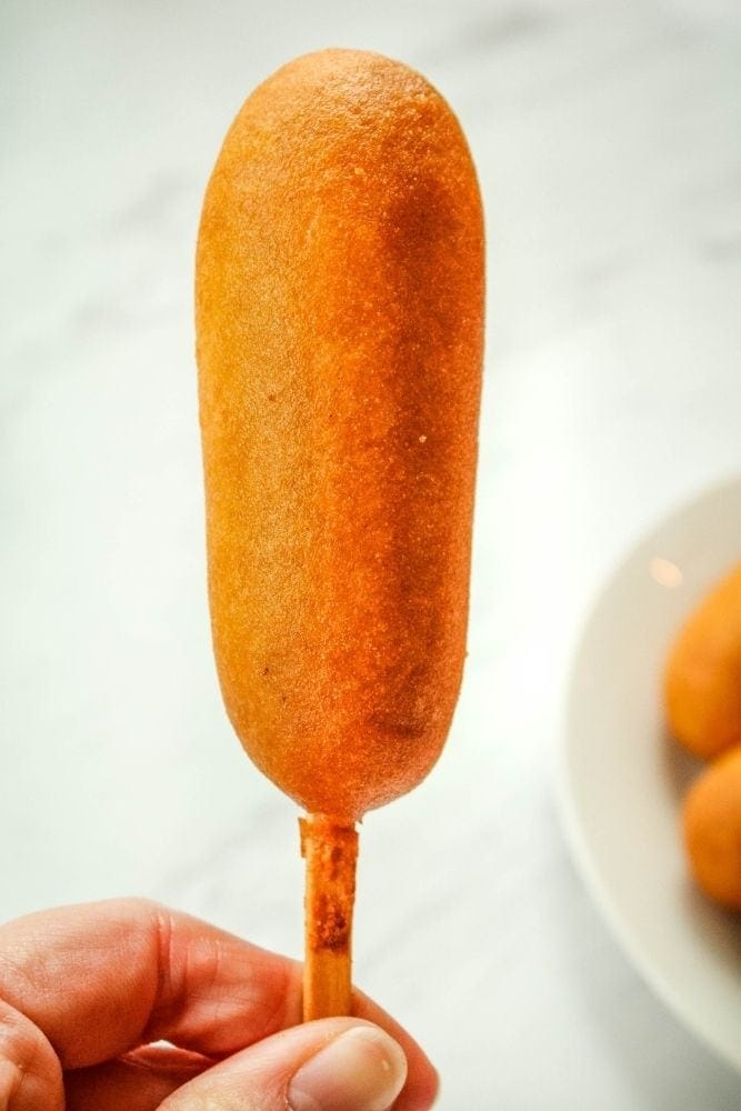 Frozen Air Fryer Corn Dog in hand