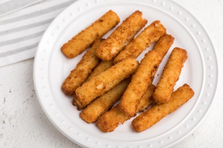 Air Fryer Frozen Fish Sticks on a white plate