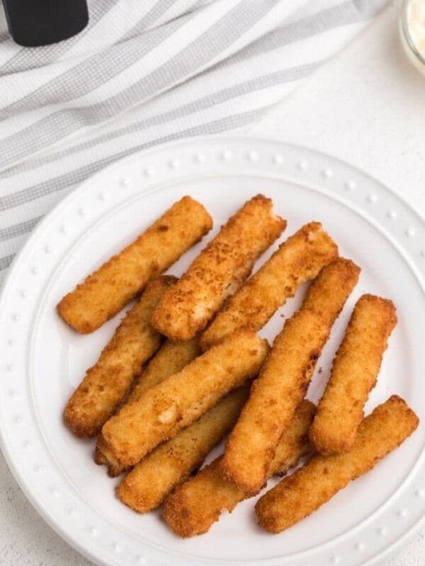 Frozen Air Fryer Fish Sticks on a white plate
