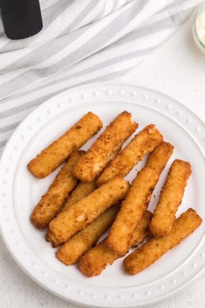 Frozen Air Fryer Fish Sticks on a white plate