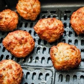 Cooked meatballs inside air fryer