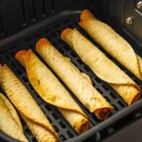 Cooked taquitos in an air fryer