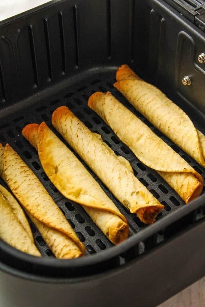 Cooked taquitos in an air fryer
