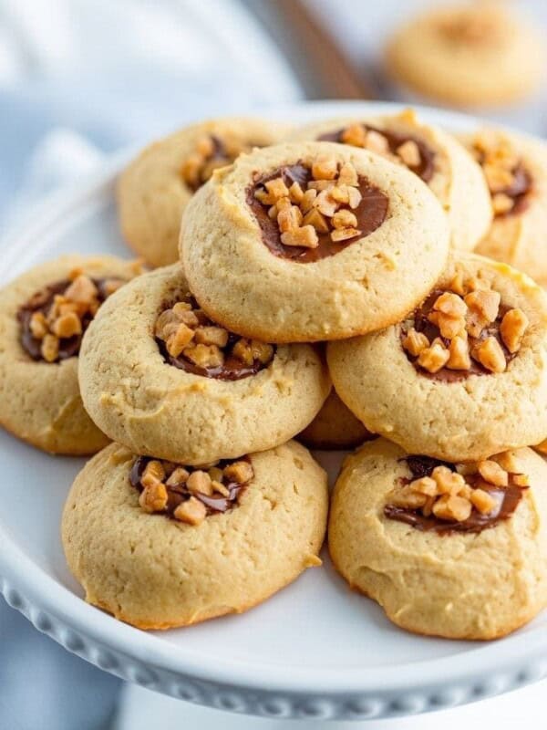 Toffee Cookies stacked on a white cakestand