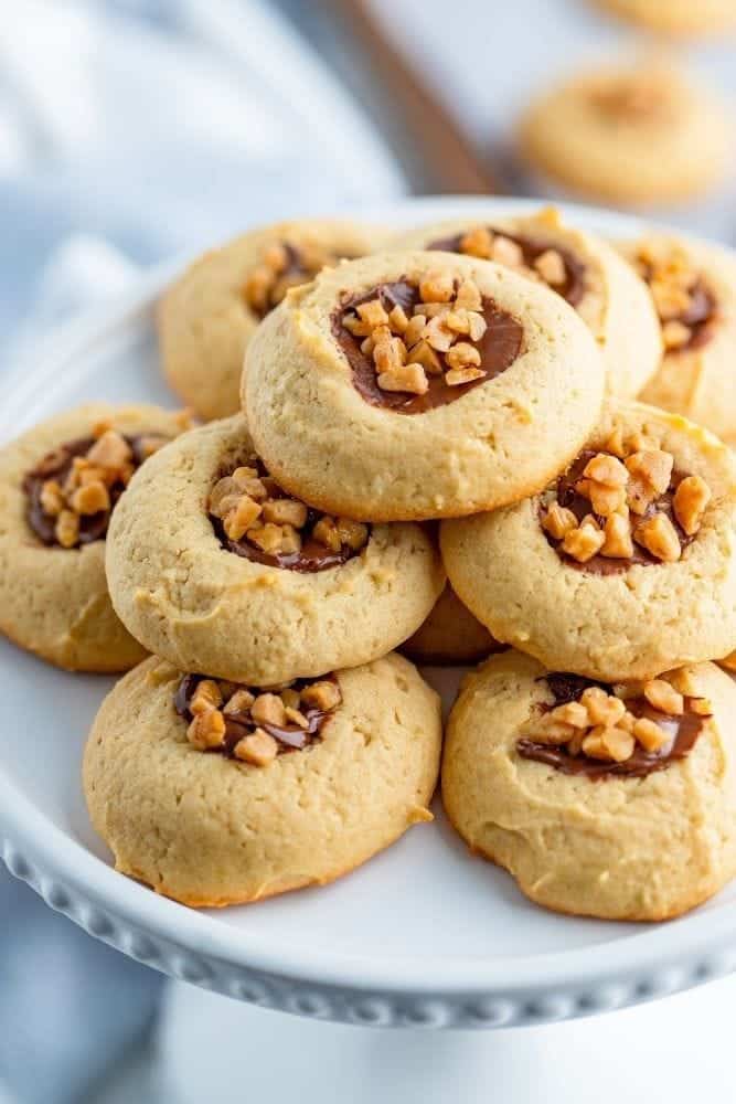 Toffee Cookies stacked on a white cakestand