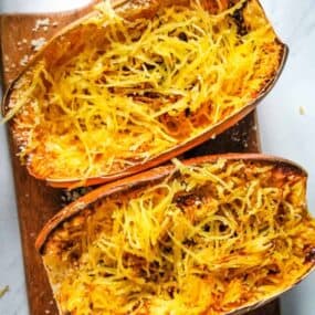 Air Fryer Spaghetti Squash cooked and cut into half with strands inside the halves
