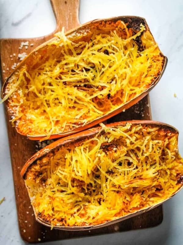 Air Fryer Spaghetti Squash cooked and cut into half with strands inside the halves