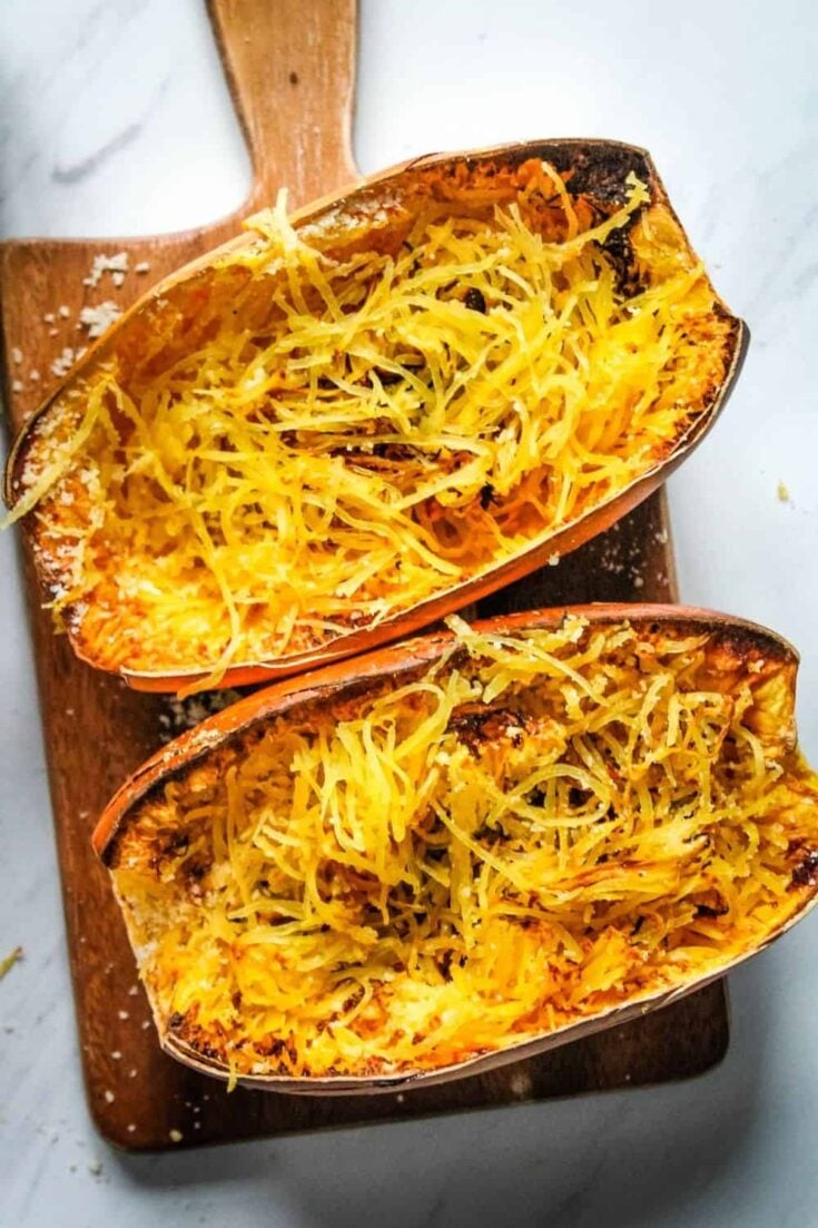 Air Fryer Spaghetti Squash cooked and cut into half with strands inside the halves