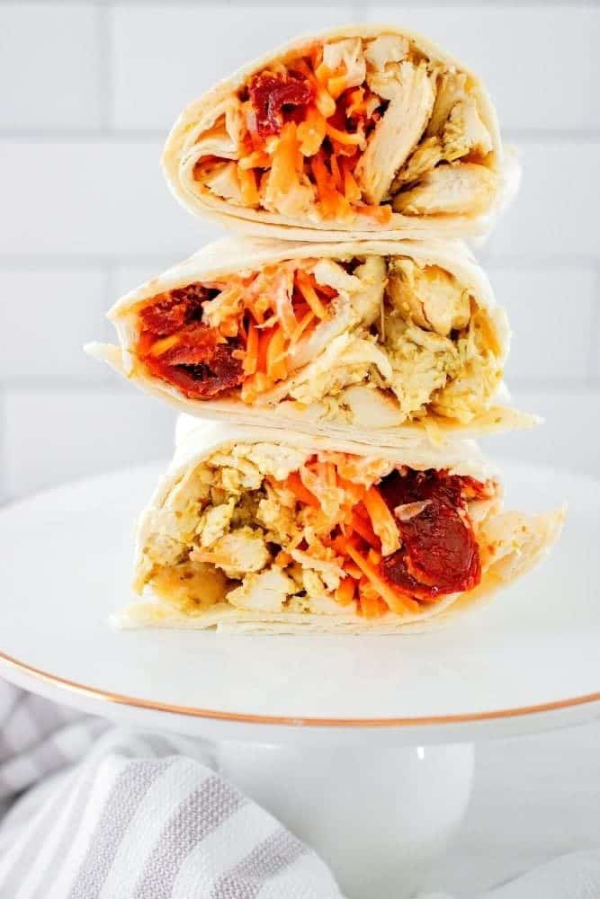 Pesto Chicken Wrap stacked on top of each other on a white plate