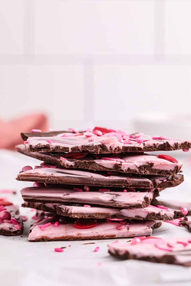 Valentine's Day Chocolate Bark stacked on each other looking from the side