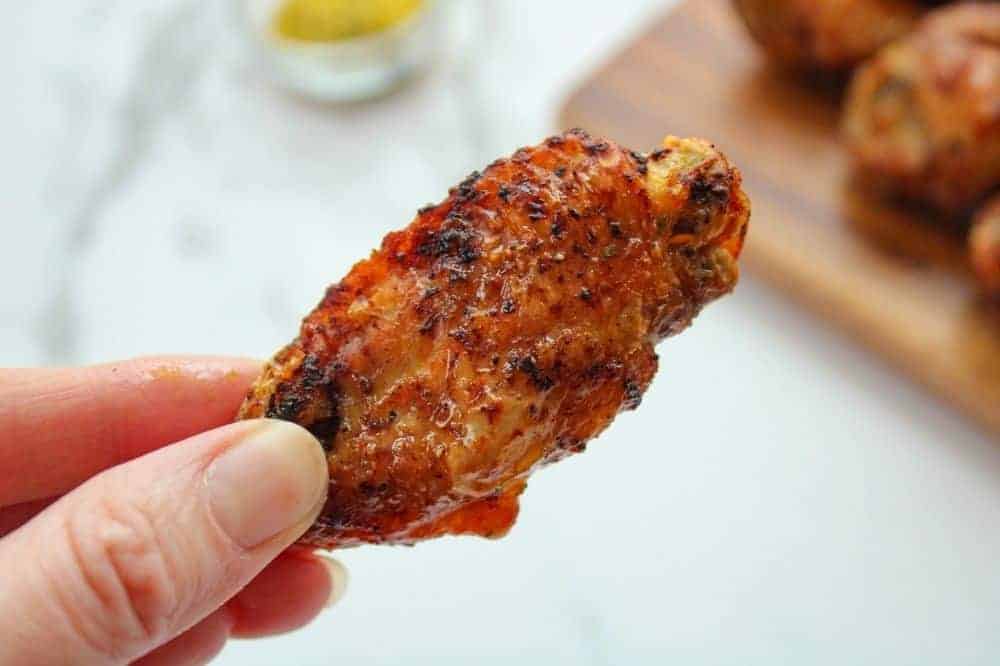 Air Fryer Chicken Wing in hand